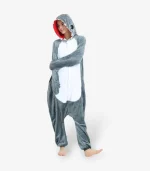 Woman with arms comfortably crossed modeling the fleece adult shark costume.