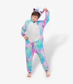 Young boy playfully holding the ear of his starry galaxy sleepwear suit.