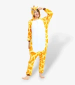Woman posing playfully in the comfortable Giraffe Onesie for Adults featuring a vibrant yellow spotted pattern.