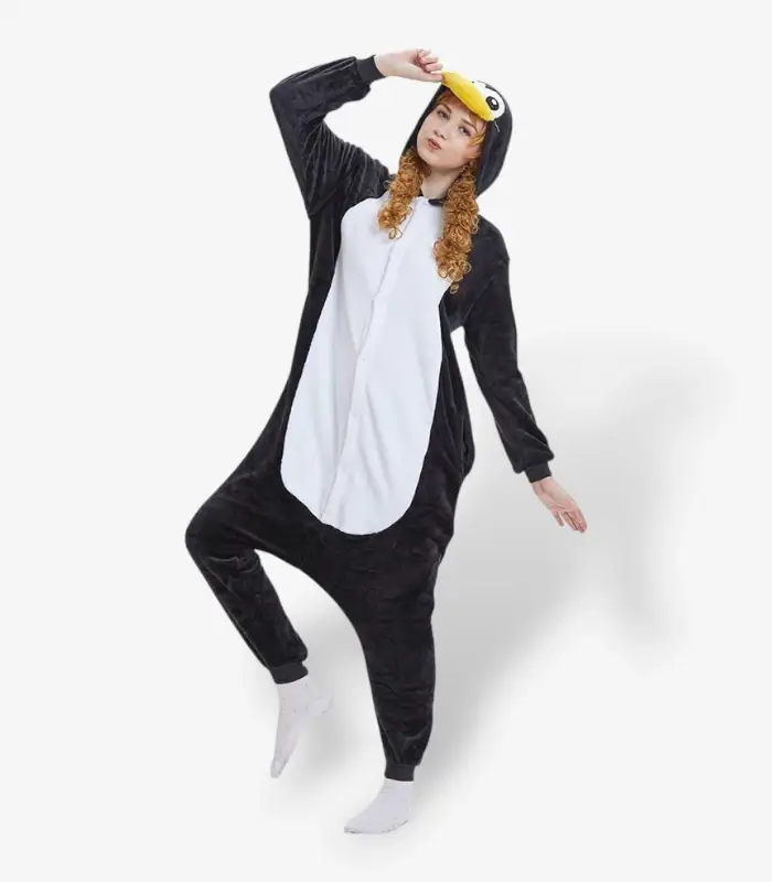 penguin-onesie-for-adults-dancing-pose Person enjoying a playful moment wearing a warm, black and white Penguin Onesie For Adults.