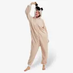 Woman playfully holding the ear of her comfortable Pug Onesie For Adults.