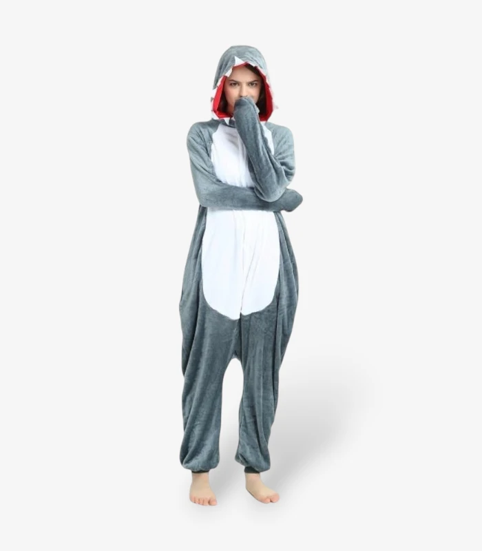 shark-onesie-for-adults Woman smiling playfully with arms raised wearing the comfortable Shark Onesie For Adults.