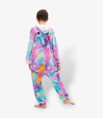 Back angle of colorful children's pajamas showing the rainbow tail and star pattern across the fabric.