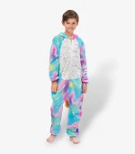 standing straight wearing a bright galaxy-patterned Unicorn Onesie for Kids against a light background.